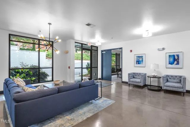 a living room with furniture and a large window