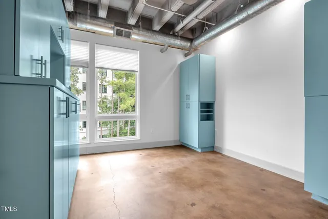 a view of a room with a large window