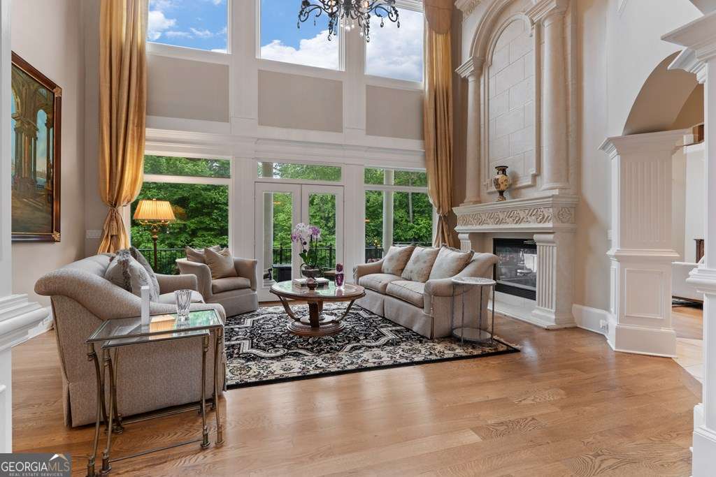 1005 Oak Mountain Road Carrollton, GA 30116 - Photo 11 of 59 a living room with furniture fireplace and a large window
