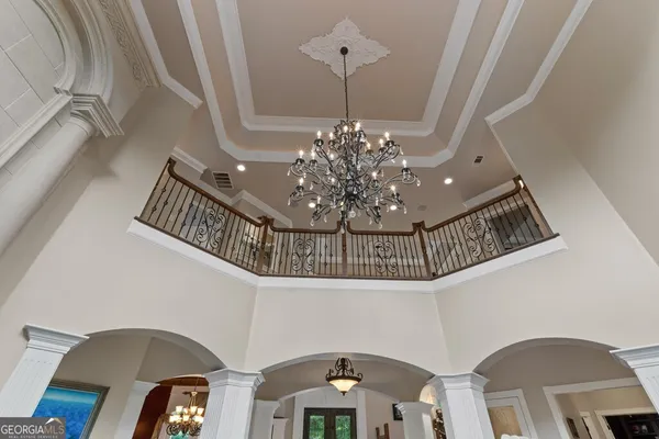 a kitchen with stainless steel appliances granite countertop a refrigerator a sink and a stove