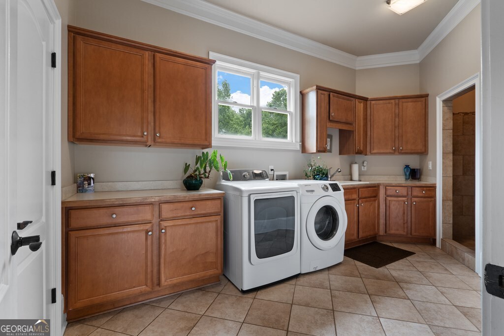 1005 Oak Mountain Road Carrollton, GA 30116 - Photo 23 of 59 a utility room with sink dryer and washer