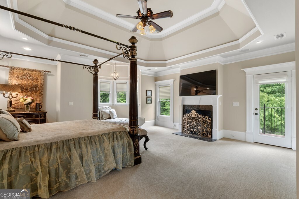 1005 Oak Mountain Road Carrollton, GA 30116 - Photo 27 of 59 a bed sitting in a spacious bedroom next to a window