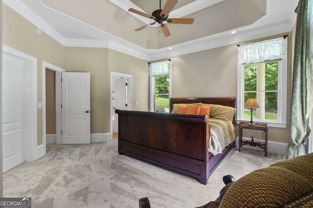 1005 Oak Mountain Road Carrollton, GA 30116 - Photo 36 of 59 a bedroom with a bed couch and window