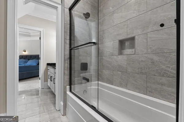 a kitchen with stainless steel appliances granite countertop a refrigerator and a stove