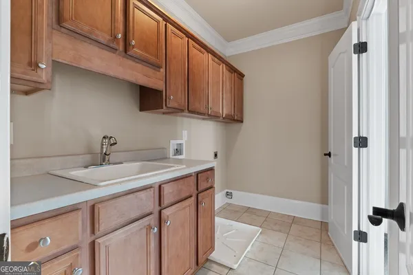a bathroom with a toilet a sink and shower