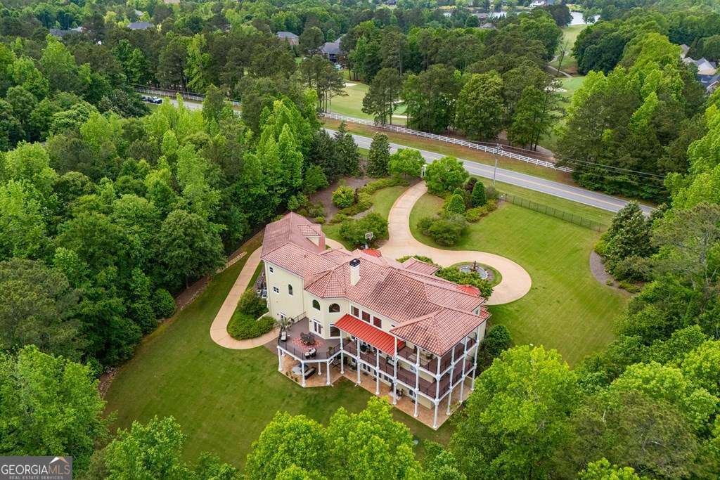 1005 Oak Mountain Road Carrollton, GA 30116 - Photo 5 of 59 an aerial view of a garden with swimming pool