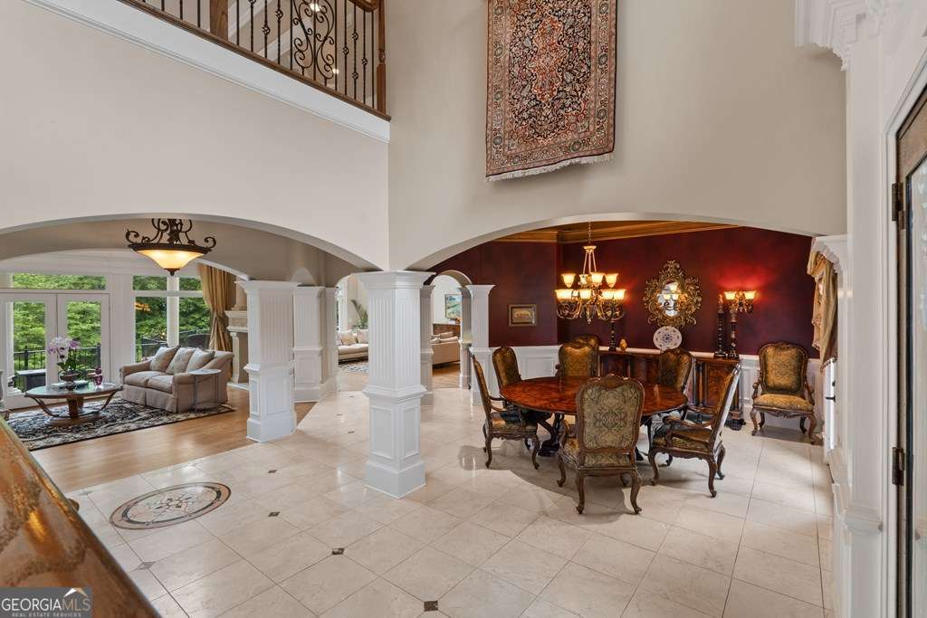 1005 Oak Mountain Road Carrollton, GA 30116 - Photo 10 of 59 a view of a dining room with furniture and chandelier