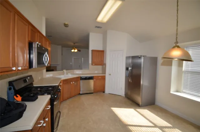 a view of empty room with fireplace