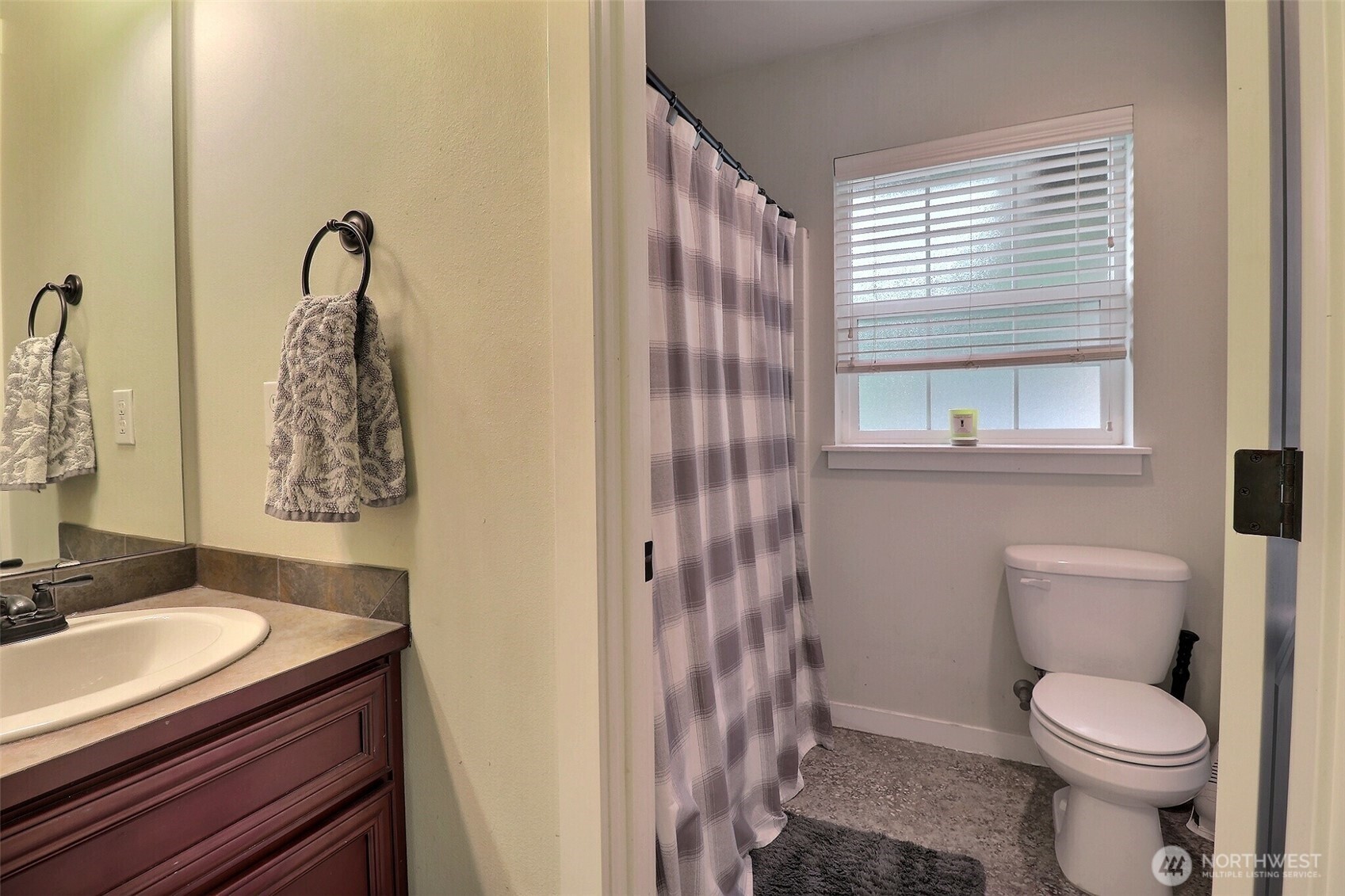 19776 Mountain Ridge Road Southeast Monroe, WA 98272 - Photo 30 of 40 a bathroom with a granite countertop toilet a sink and a mirror