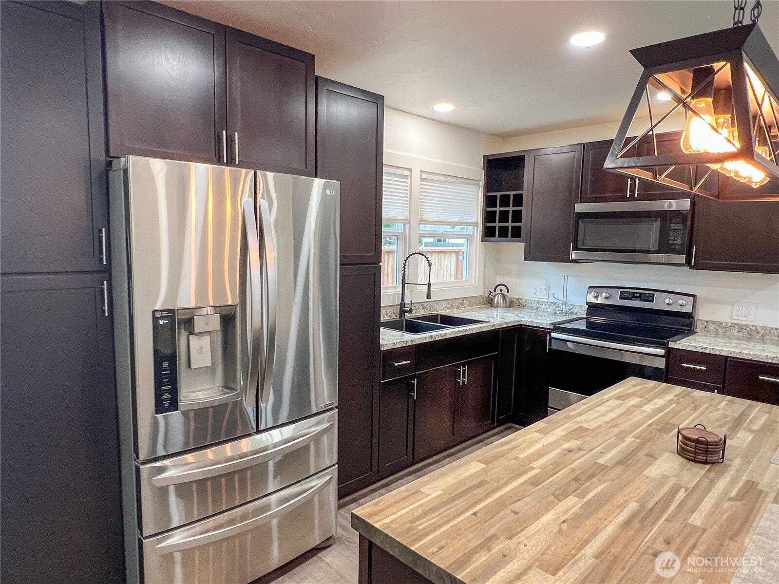 6192 State Rte 20 Port Townsend, WA 98368 - Photo 8 of 25 a kitchen with stainless steel appliances granite countertop a refrigerator and a stove