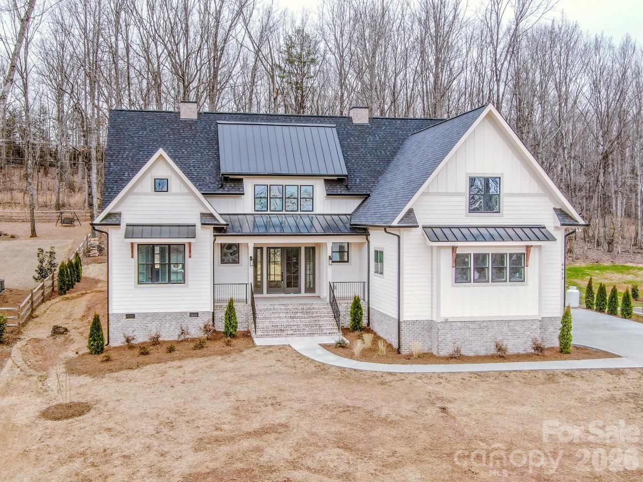 4453 Brancer Lane, Unit 4 Lincolnton, NC 28092 - Photo 1 of 48 a front view of a house with a yard and garage