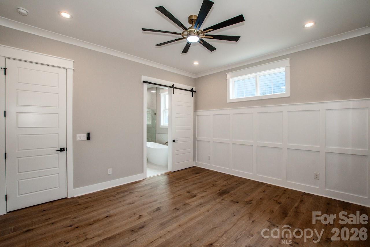 4453 Brancer Lane, Unit 4 Lincolnton, NC 28092 - Photo 23 of 48 wooden floor in an empty room with a window