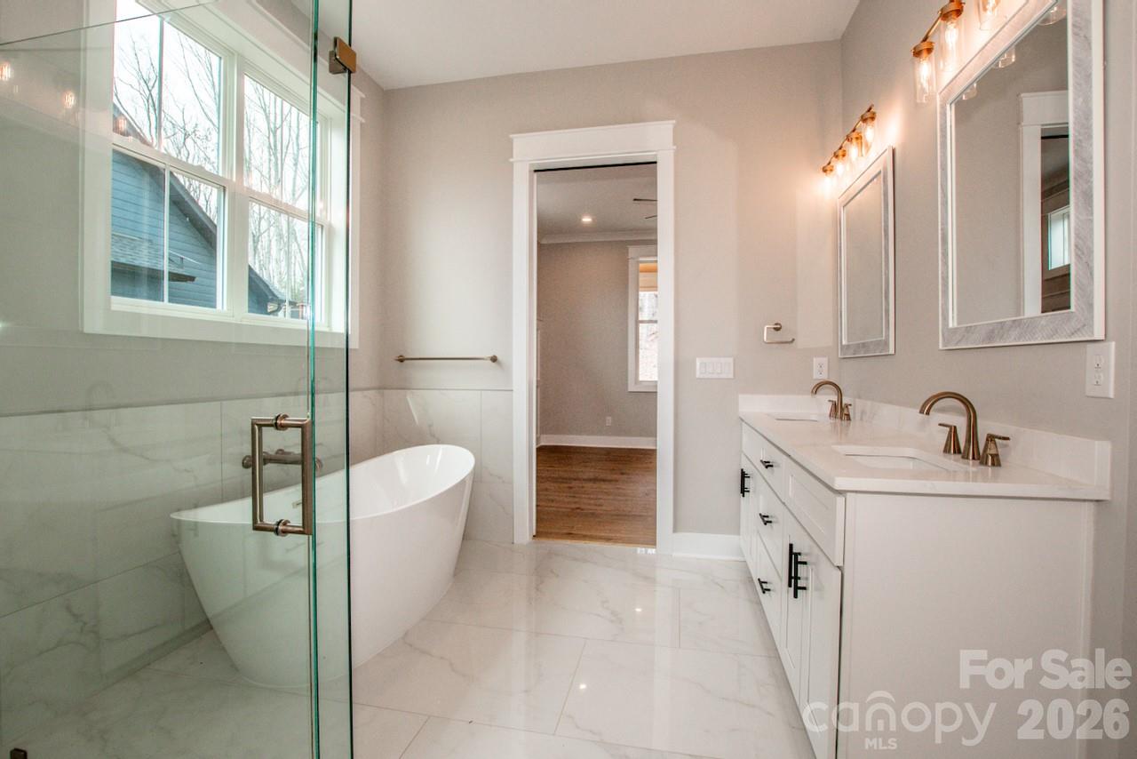 4453 Brancer Lane, Unit 4 Lincolnton, NC 28092 - Photo 25 of 48 a bathroom with a sink a toilet and mirror