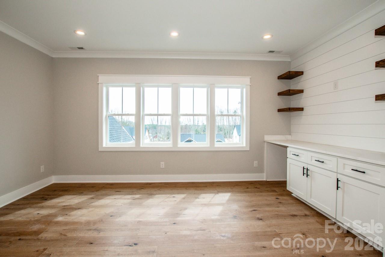 4453 Brancer Lane, Unit 4 Lincolnton, NC 28092 - Photo 33 of 48 a view of an empty room with window and cabinet