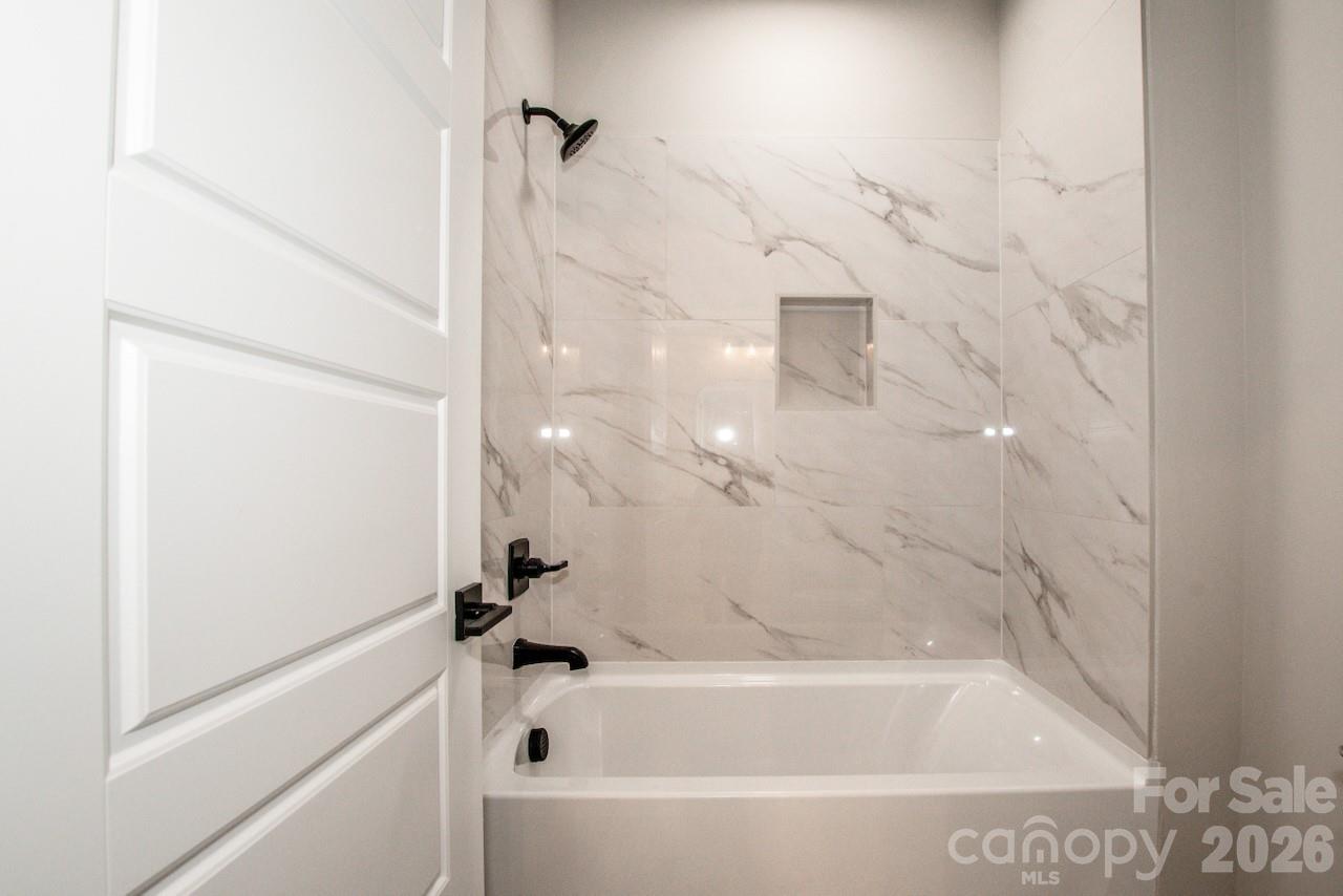 4453 Brancer Lane, Unit 4 Lincolnton, NC 28092 - Photo 37 of 48 a bathroom with bathtub and shower