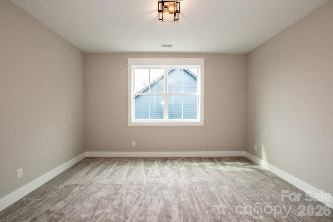 4453 Brancer Lane, Unit 4 Lincolnton, NC 28092 - Photo 40 of 48 an empty room with wooden floor and windows