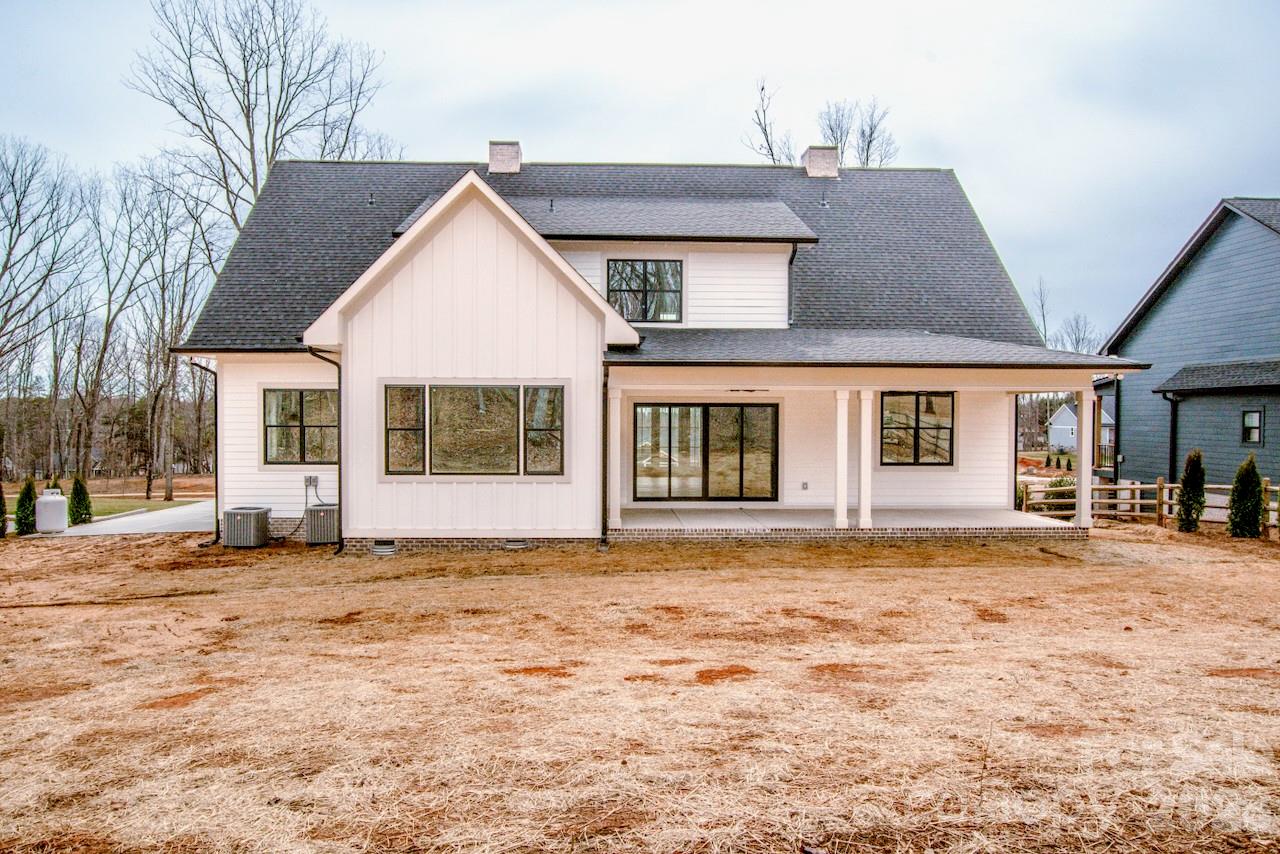 4453 Brancer Lane, Unit 4 Lincolnton, NC 28092 - Photo 45 of 48 a front view of a house with a garden