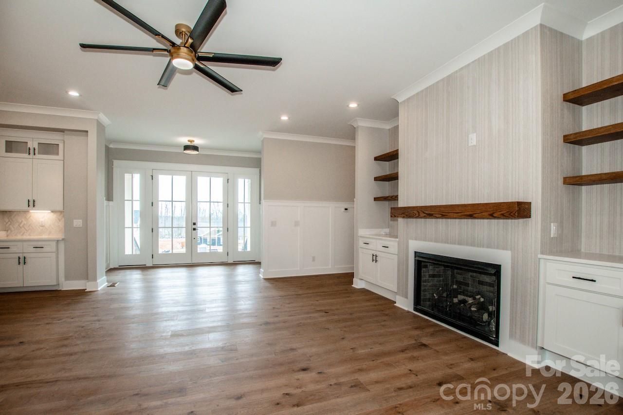 4453 Brancer Lane, Unit 4 Lincolnton, NC 28092 - Photo 7 of 48 a view of an empty room with a fireplace and a window
