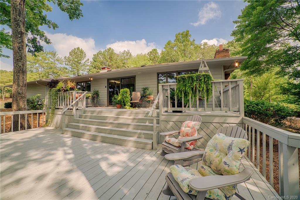 14 Holly Ridge Lane Tryon, NC 28782 - Photo 12 of 42 a view of a patio with couches table and chairs and potted plants