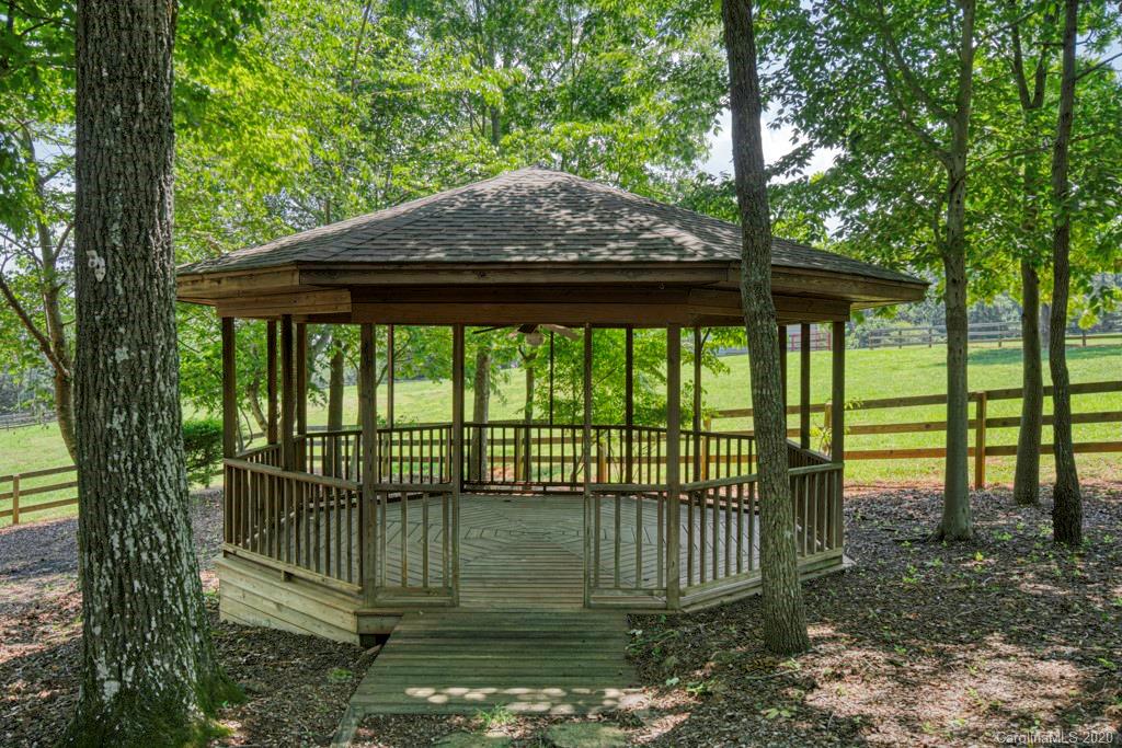 14 Holly Ridge Lane Tryon, NC 28782 - Photo 13 of 42 a small garden covered with tall trees