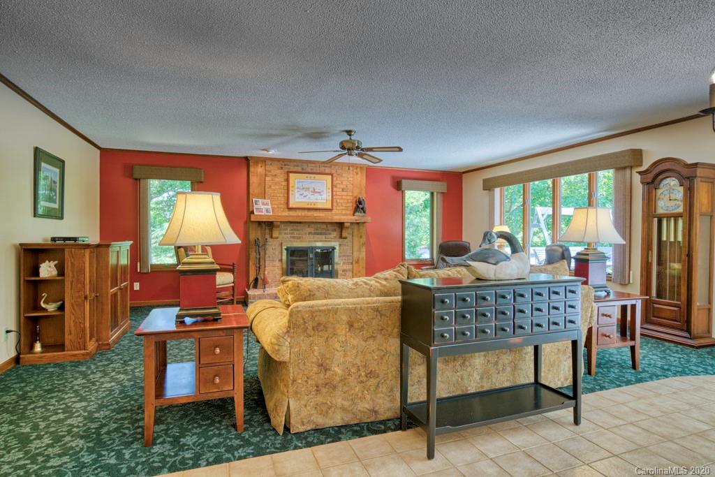 14 Holly Ridge Lane Tryon, NC 28782 - Photo 15 of 42 a living room with furniture a fireplace and a table