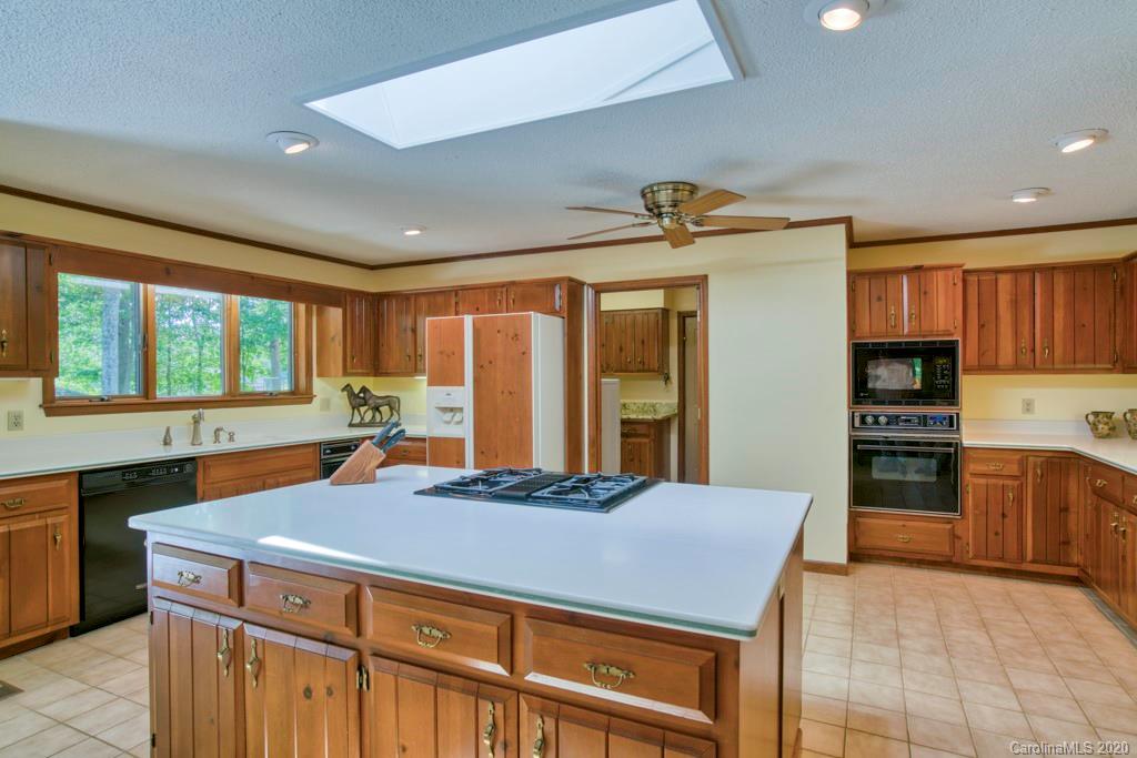 14 Holly Ridge Lane Tryon, NC 28782 - Photo 19 of 42 a kitchen with a stove a refrigerator and a sink