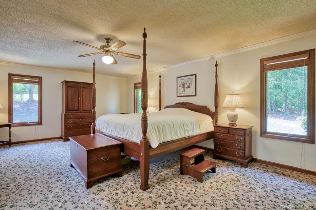 14 Holly Ridge Lane Tryon, NC 28782 - Photo 22 of 42 a bedroom with a bed dresser and a window