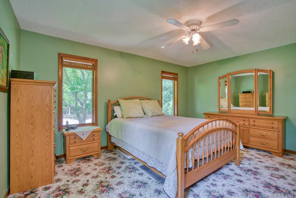 14 Holly Ridge Lane Tryon, NC 28782 - Photo 28 of 42 a bedroom with a bed and a window