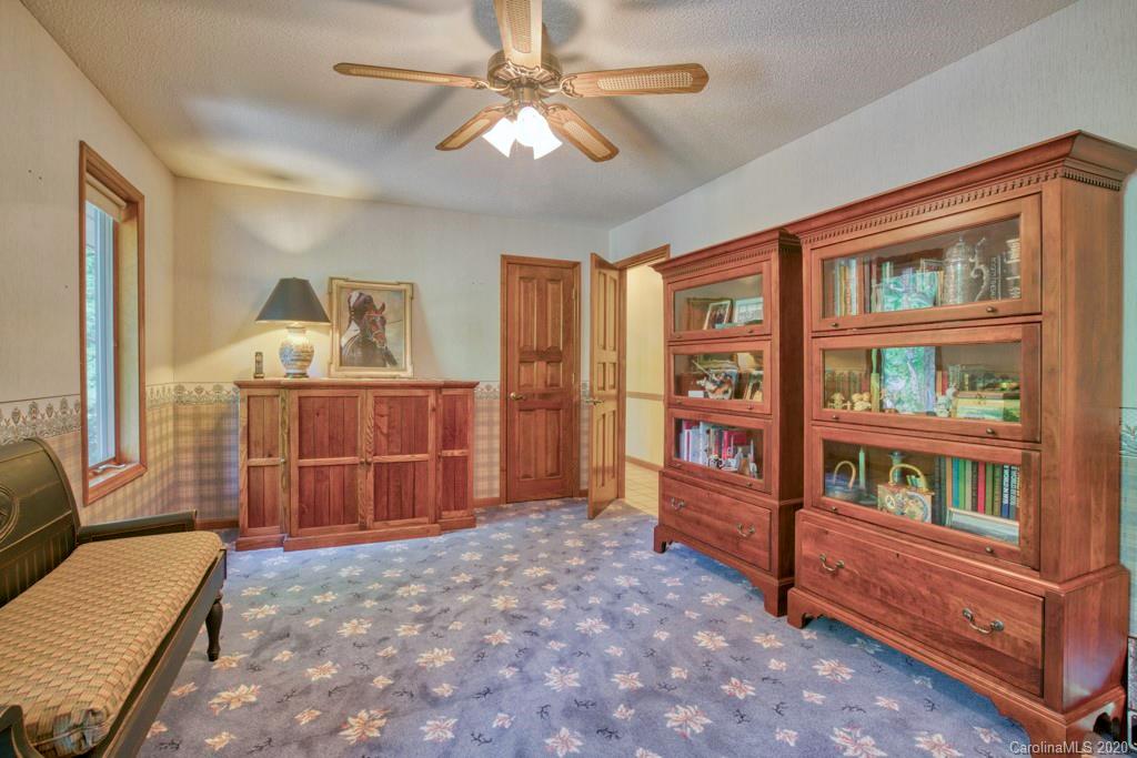 14 Holly Ridge Lane Tryon, NC 28782 - Photo 30 of 42 a living room with fish tank and a dresser