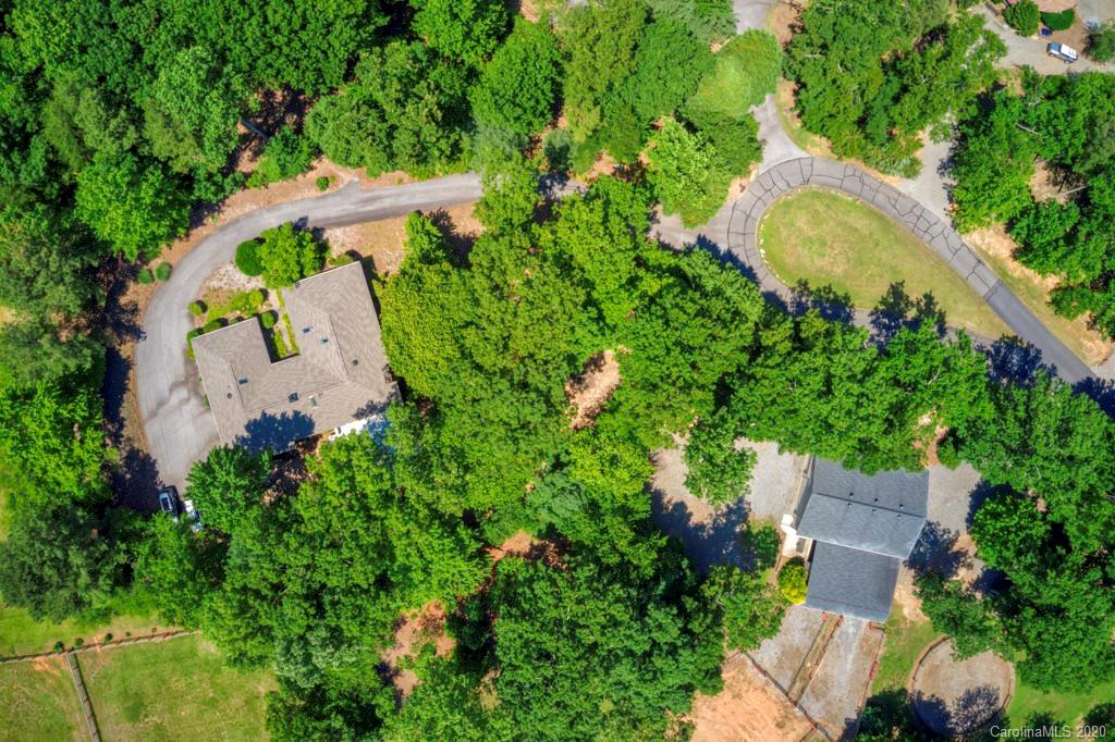 14 Holly Ridge Lane Tryon, NC 28782 - Photo 4 of 42 an aerial view of a house with a swimming pool and garden