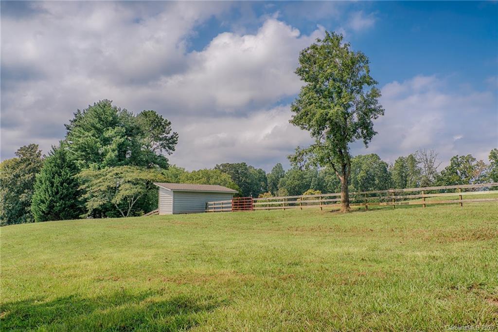 14 Holly Ridge Lane Tryon, NC 28782 - Photo 42 of 42 a view of a swimming pool with an outdoor seating and a yard
