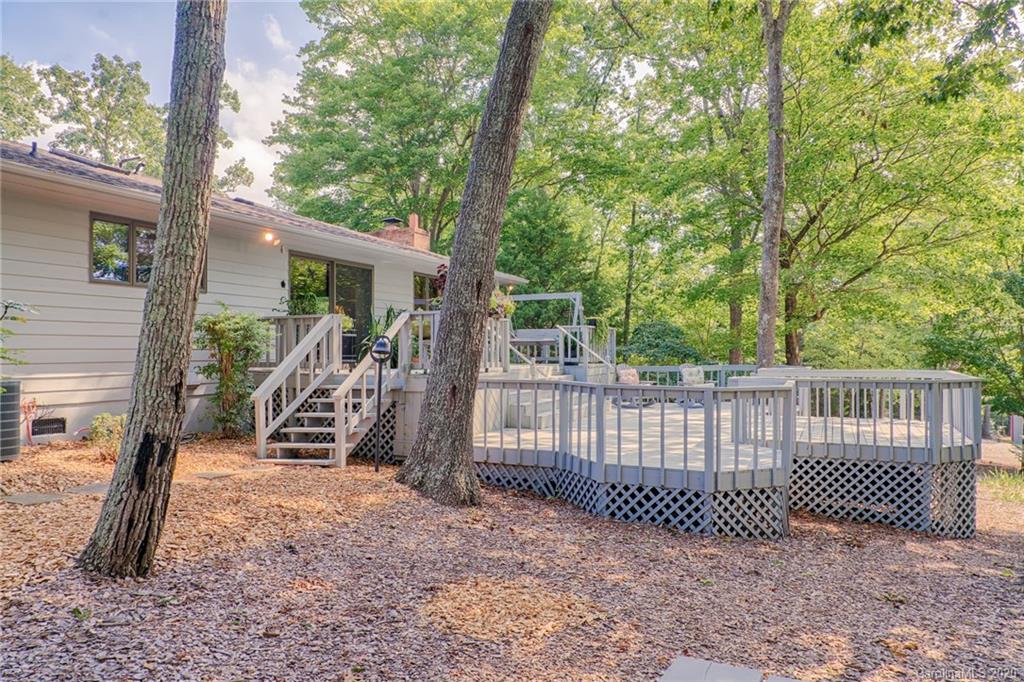 14 Holly Ridge Lane Tryon, NC 28782 - Photo 10 of 42 a view of a deck with a fence and a tree