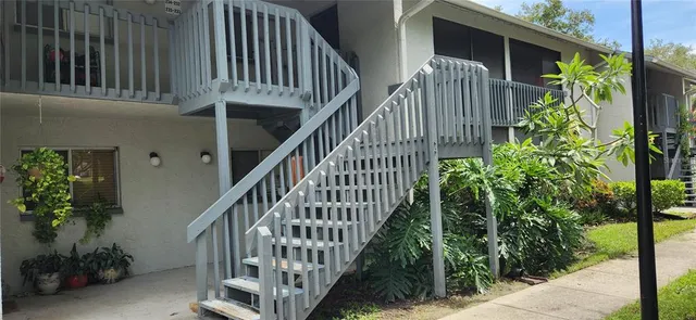 a view of entryway with flower plants