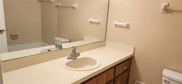 a view of yard with swimming pool and trees