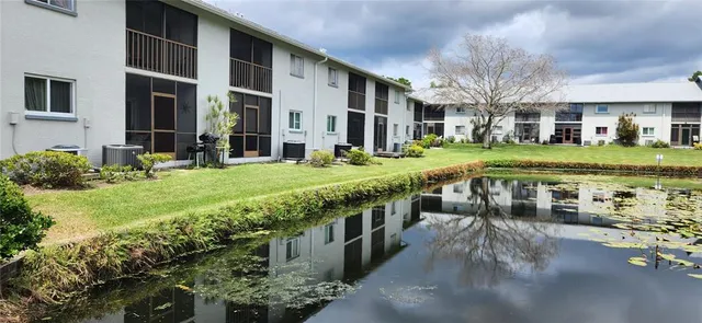 a view of swimming pool with chairs