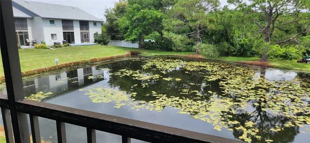 a view of a house with a yard from a balcony