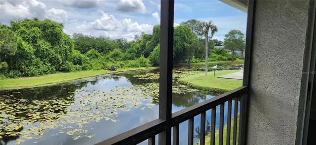 a view of a garden from a balcony