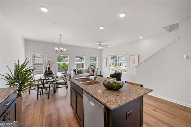 a kitchen with counter space and wooden floor