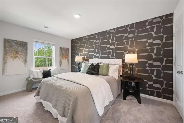 a bedroom with a bed and a window