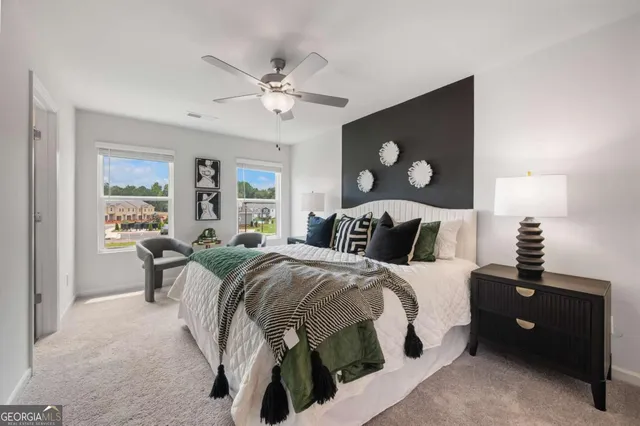 a bed room with a bed and a lamp