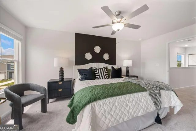 a bedroom with a bed and window