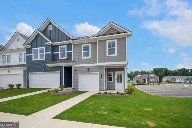 a front view of a house with a yard