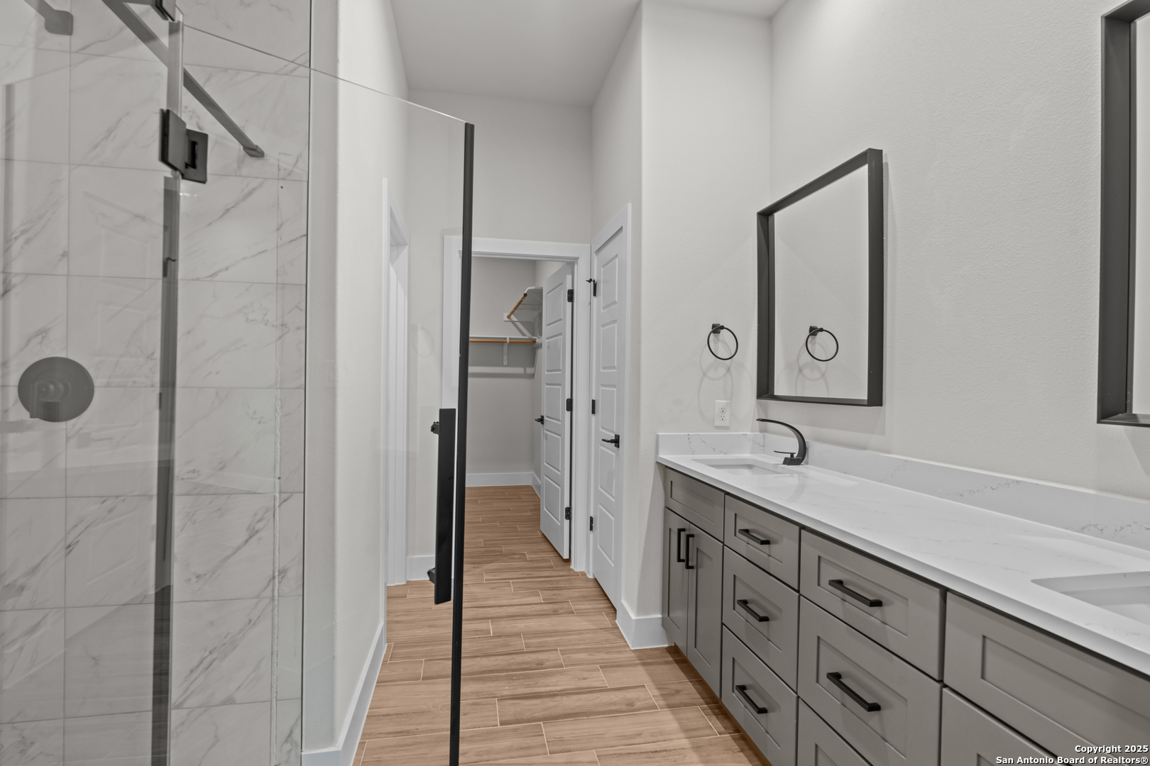 103 Robert Sloan Blanco, TX 78606 - Photo 8 of 10 a spacious bathroom with a shower sink and mirror