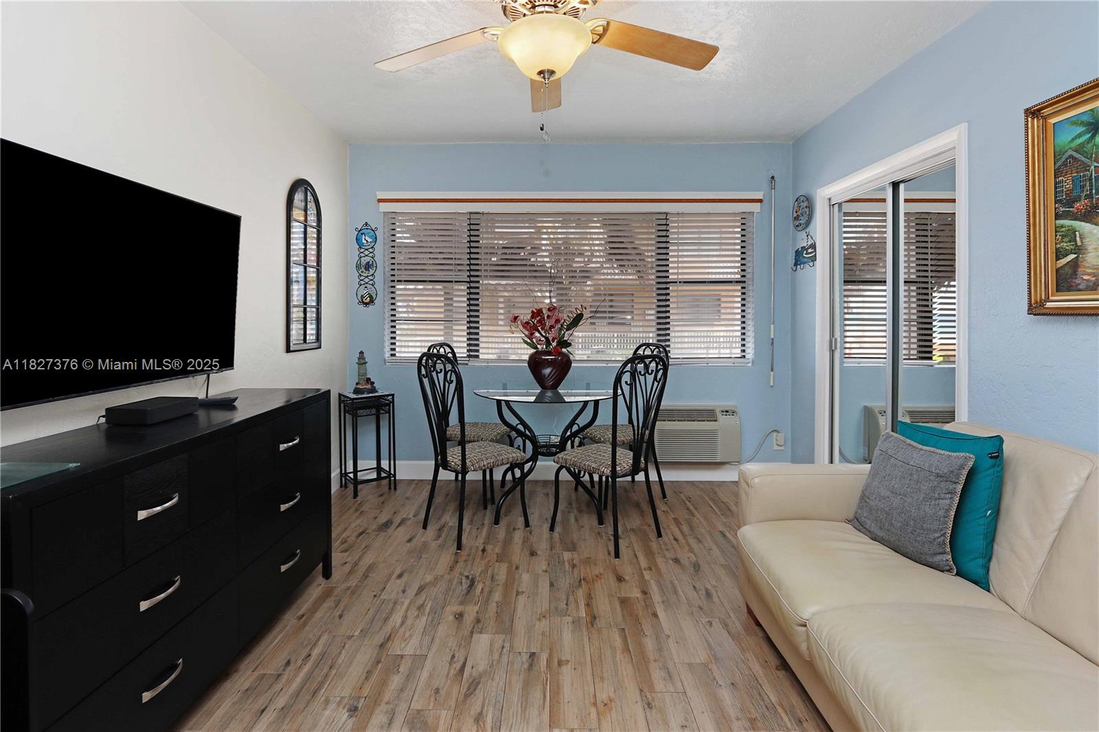 3300 North Surf Road, Unit 3A Hollywood, FL 33019 - Photo 11 of 39 a dining room with furniture and wooden floor