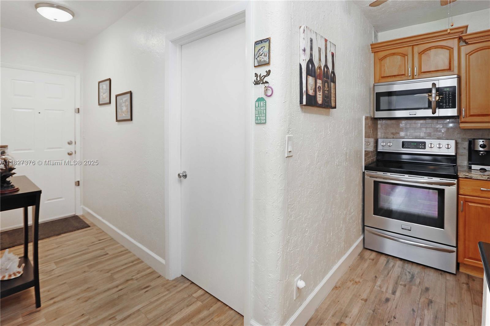 3300 North Surf Road, Unit 3A Hollywood, FL 33019 - Photo 14 of 39 a view of kitchen and wooden floor