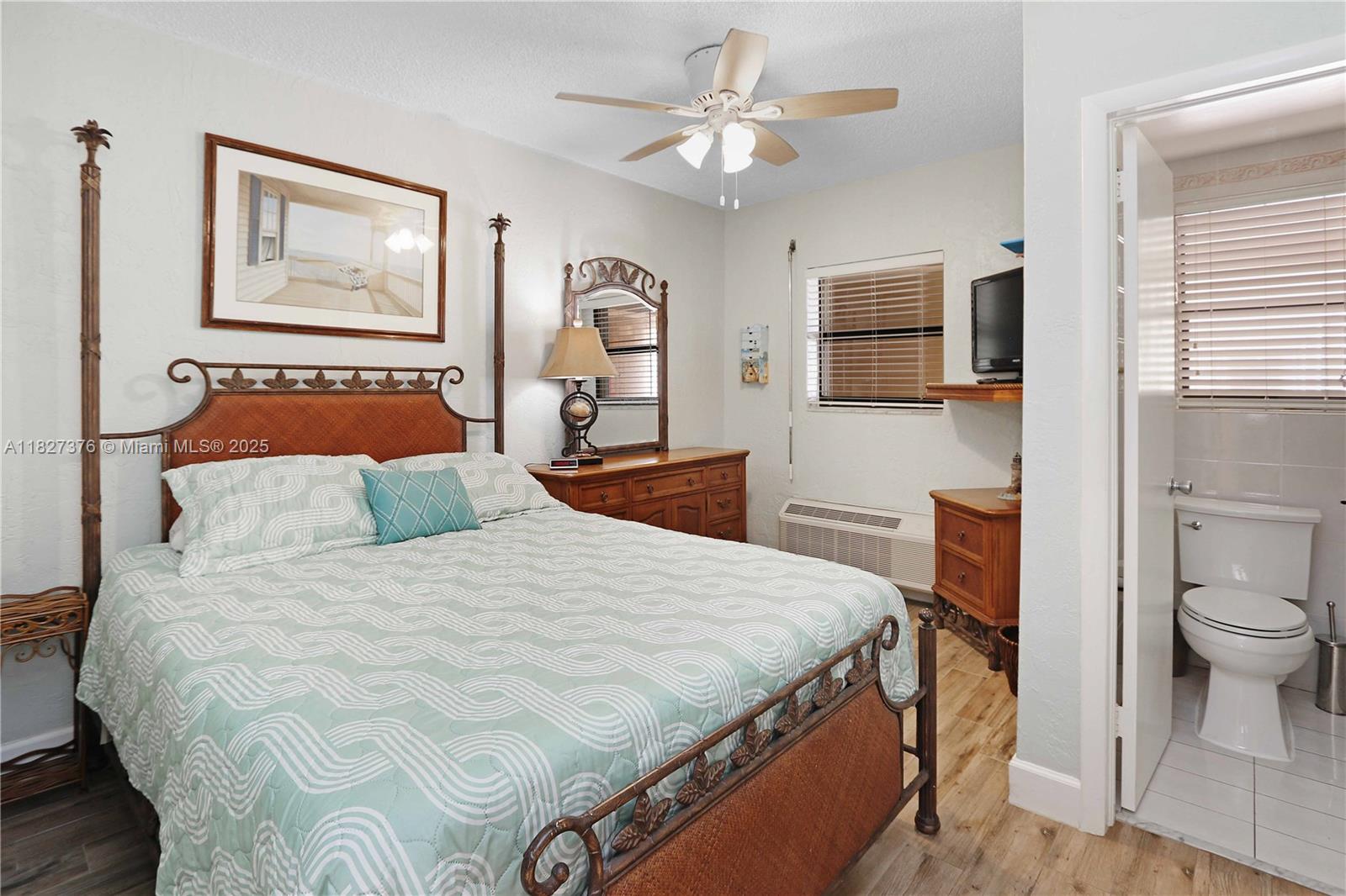 3300 North Surf Road, Unit 3A Hollywood, FL 33019 - Photo 17 of 39 a bedroom with a bed and a flat screen tv