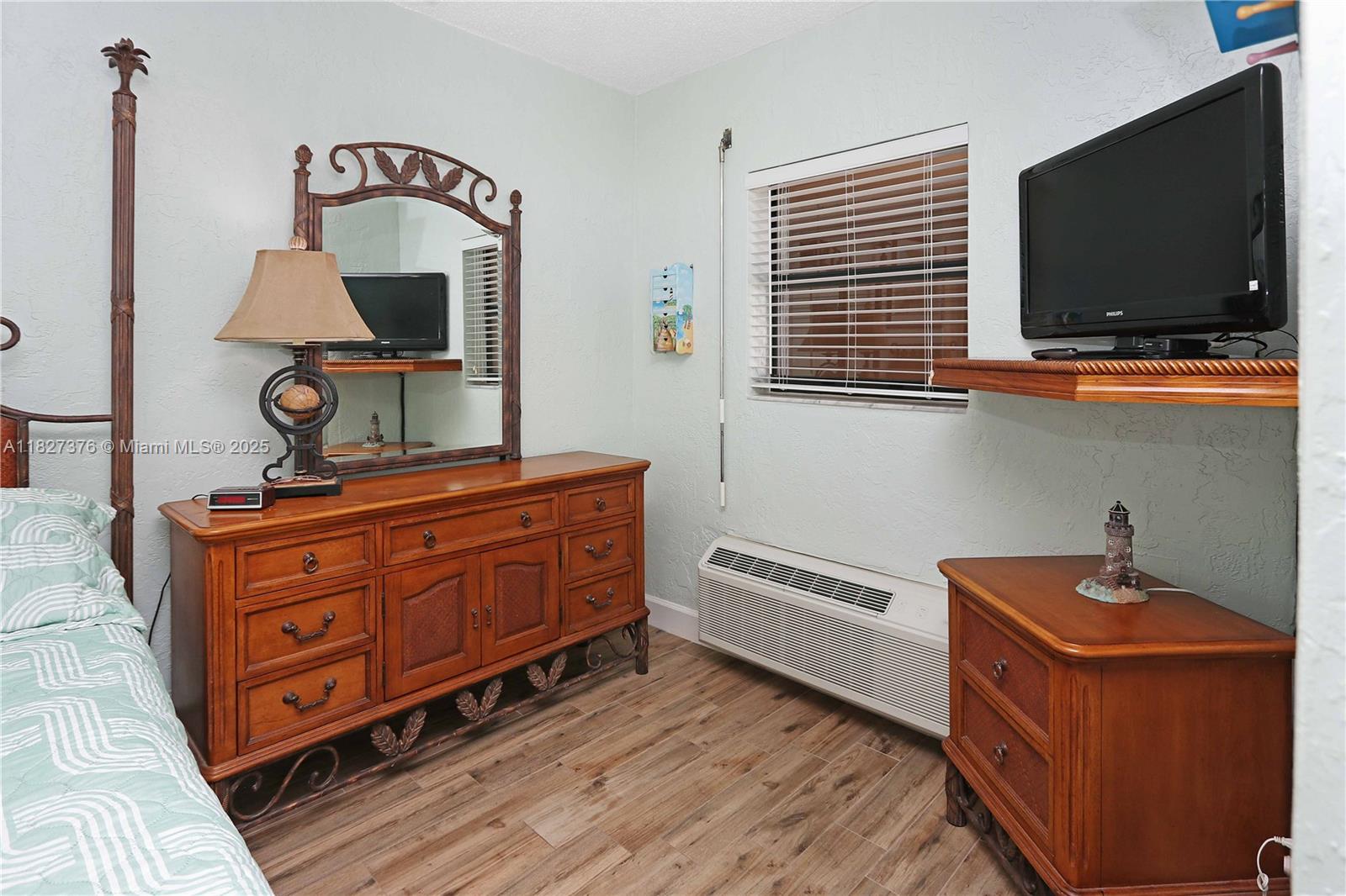 3300 North Surf Road, Unit 3A Hollywood, FL 33019 - Photo 18 of 39 a living room with furniture flat screen tv and kitchen view