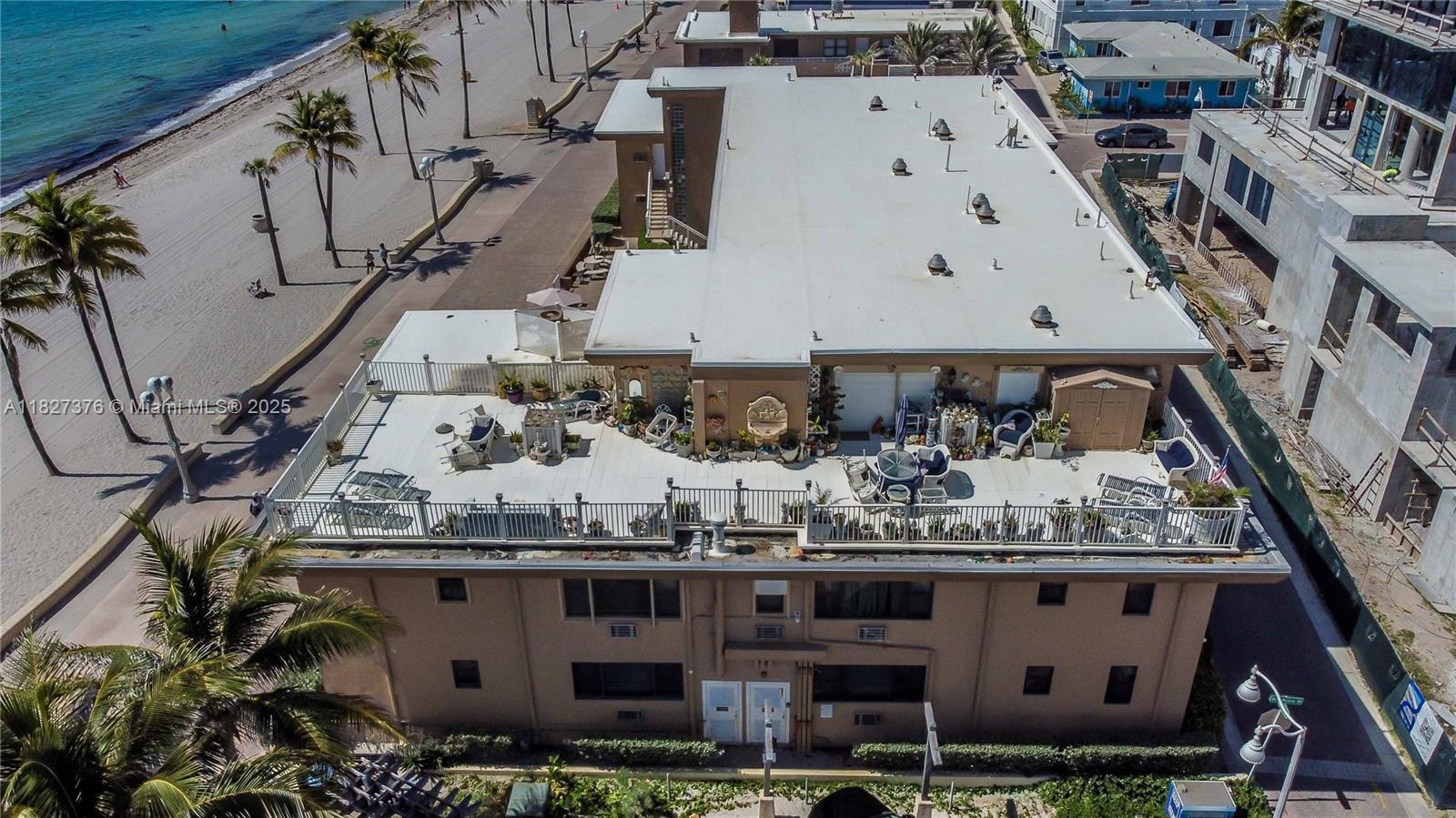 3300 North Surf Road, Unit 3A Hollywood, FL 33019 - Photo 26 of 39 a large building with a tree in the background