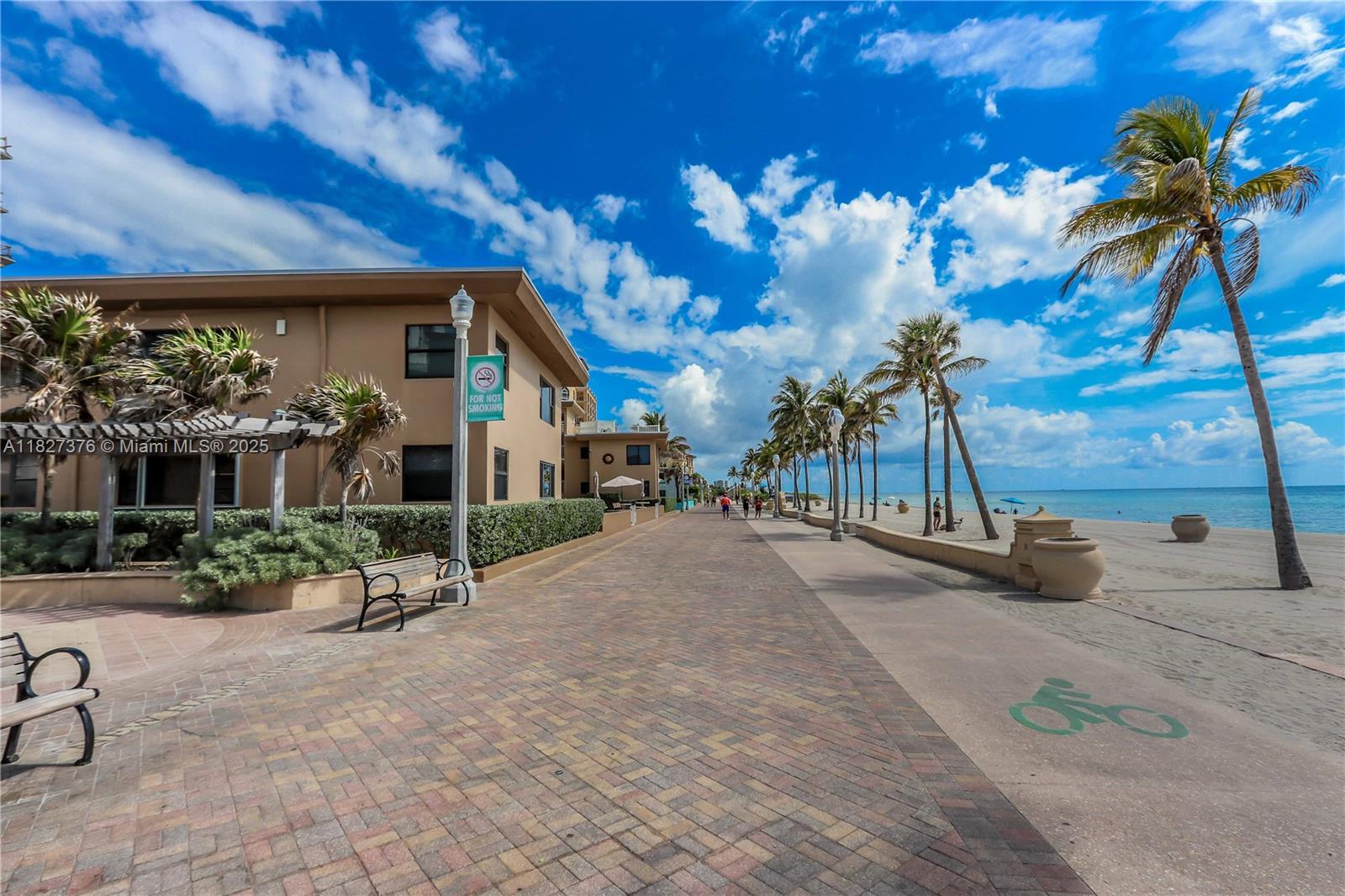 3300 North Surf Road, Unit 3A Hollywood, FL 33019 - Photo 32 of 39 a view of a patio with a table and chairs under an umbrella
