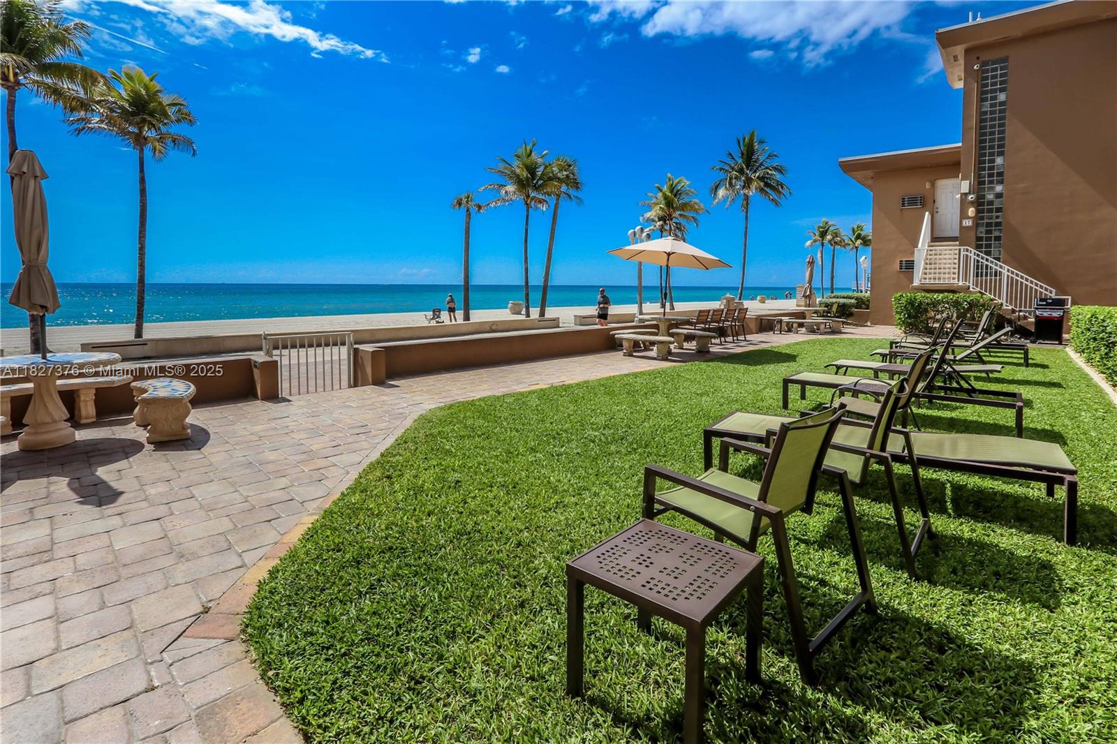 3300 North Surf Road, Unit 3A Hollywood, FL 33019 - Photo 34 of 39 a view of a chairs and table in the patio